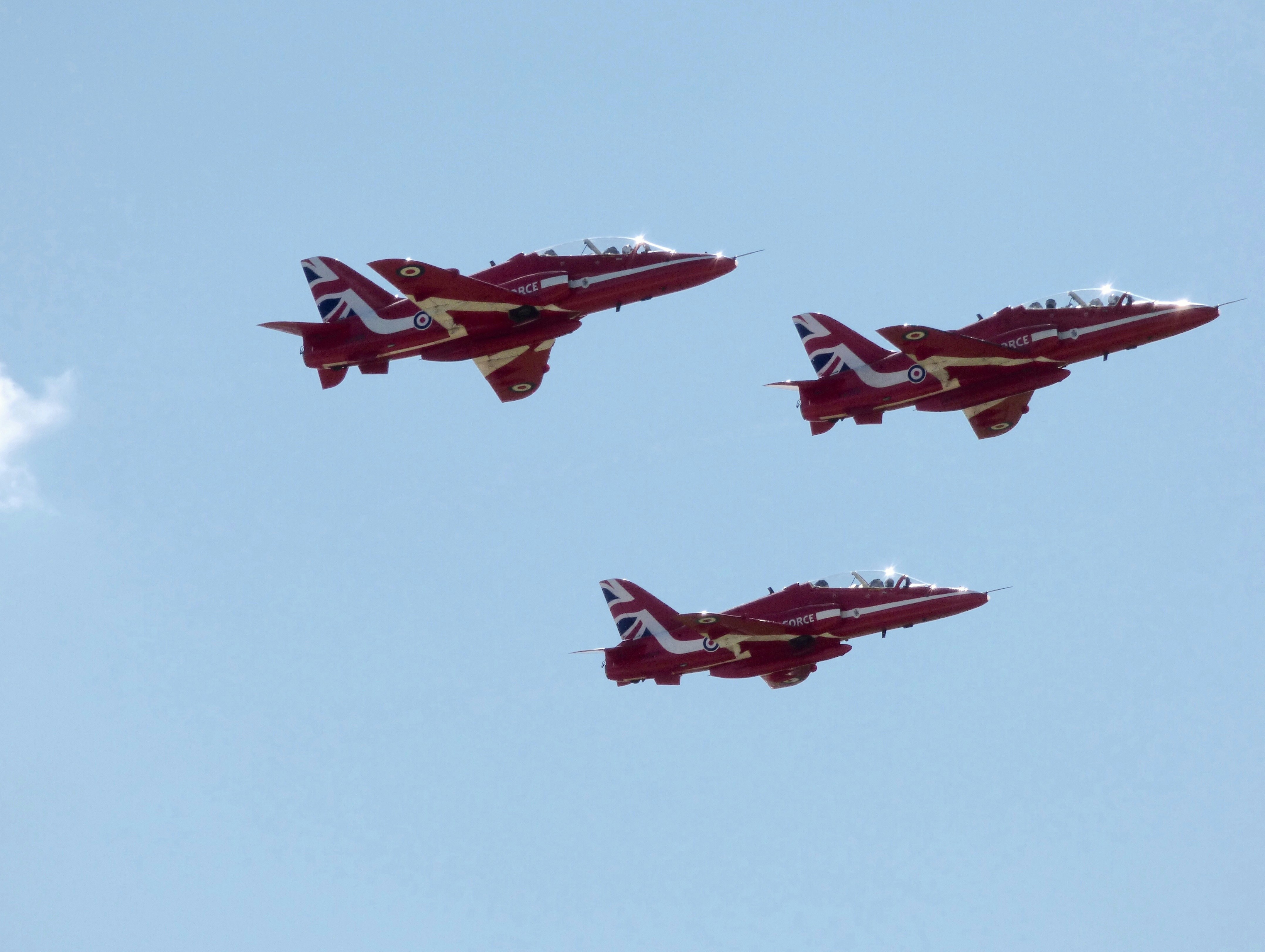 three airplanes flying mid air during daytime