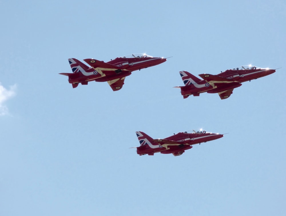 three airplanes flying mid air during daytime