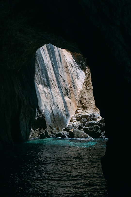 body of water under cave in Paxos Greece