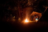 lit bonfire near tent