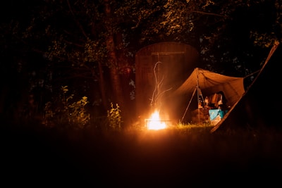 lit bonfire near tent