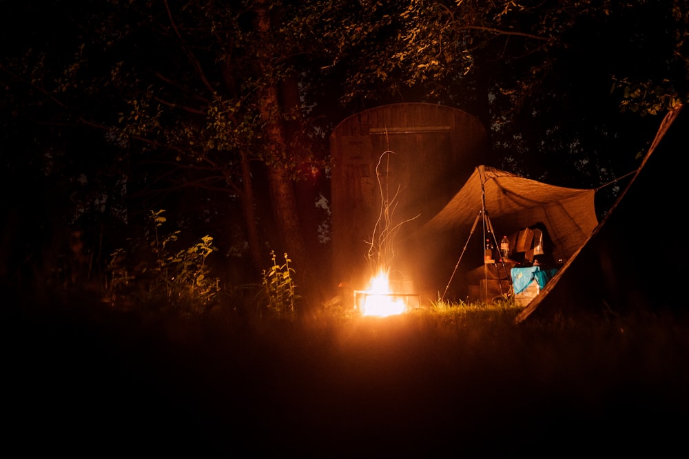 lit bonfire near tent