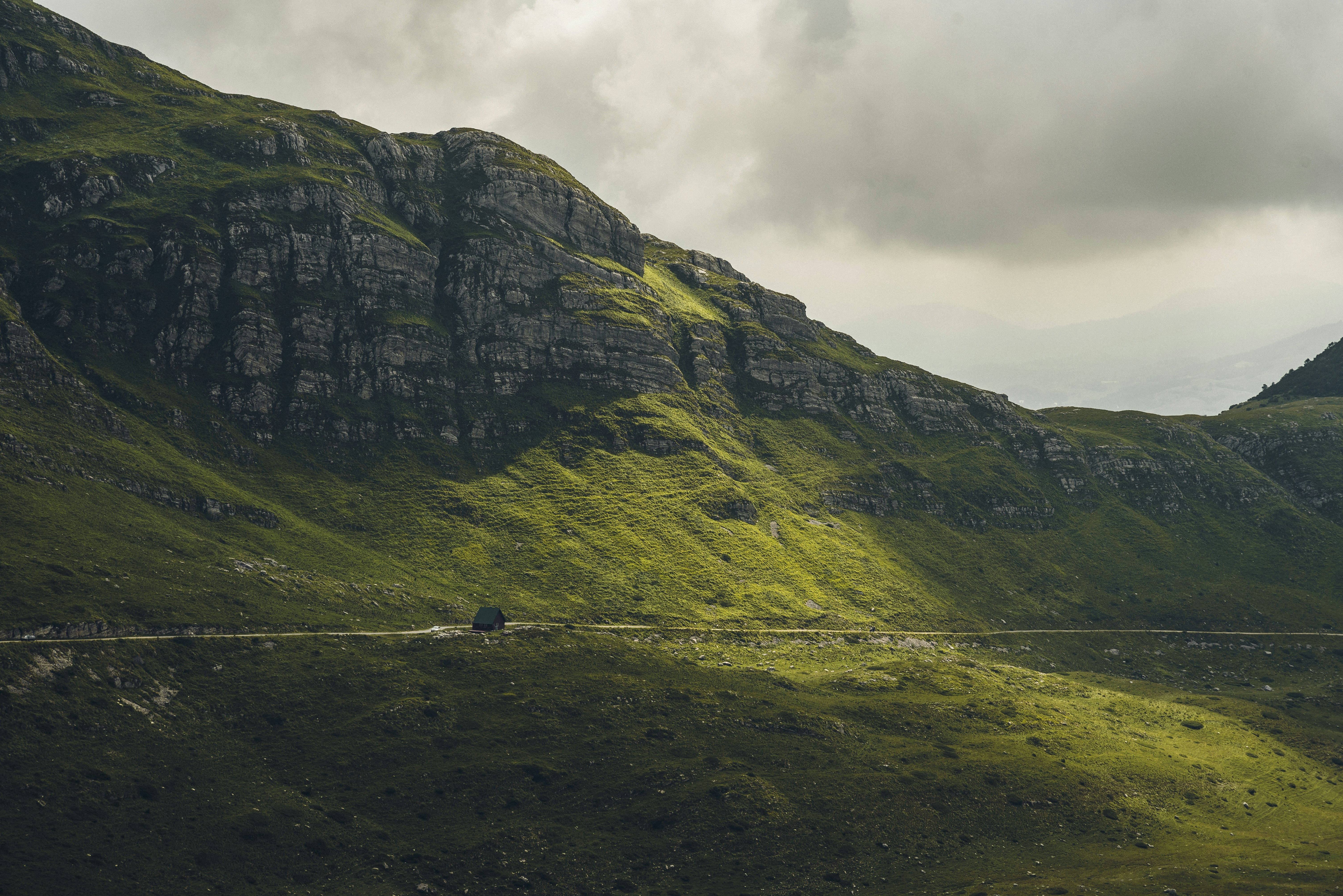 blue house near cliff during daytime