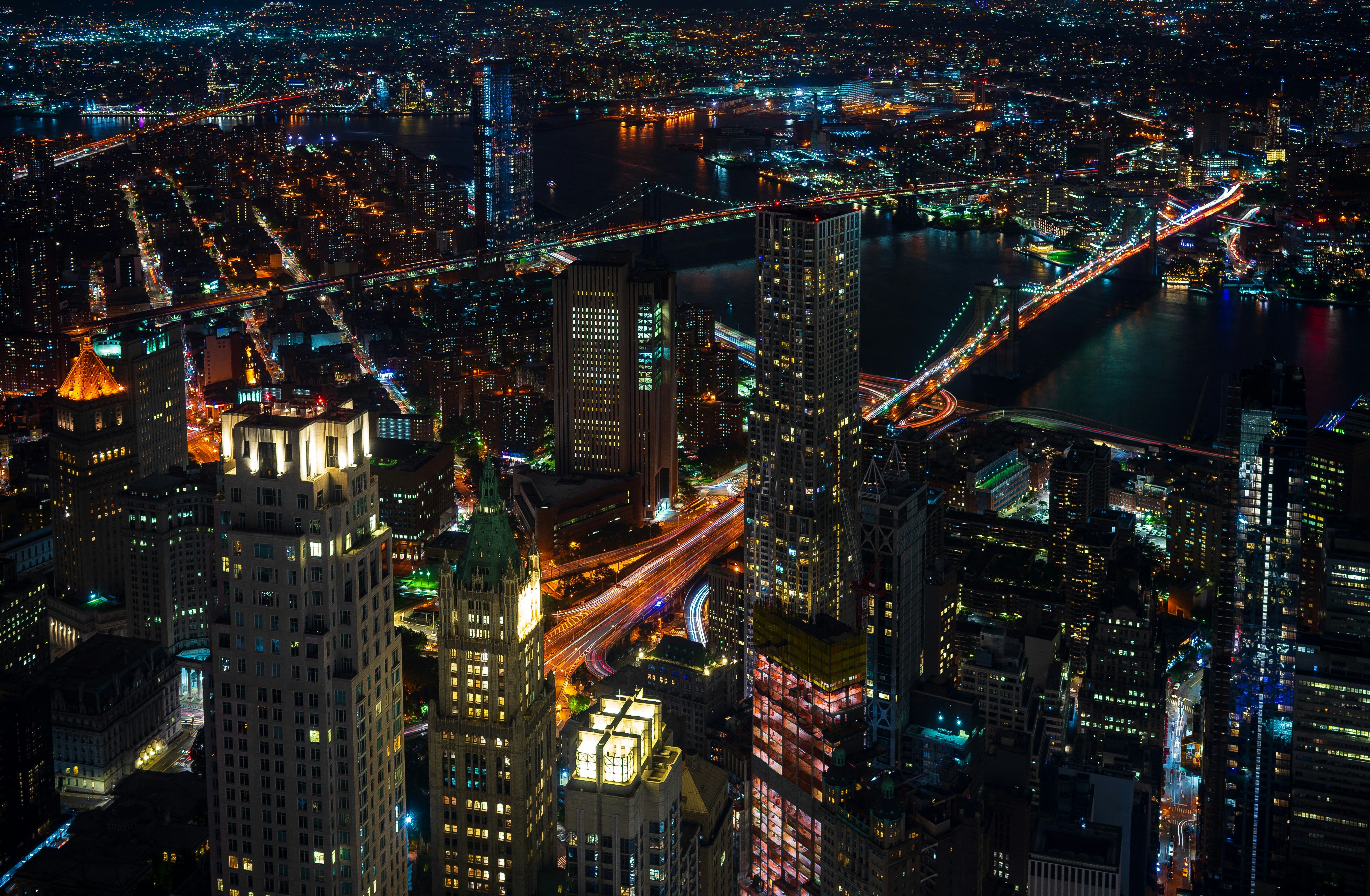 Looking down on the Brooklyn, Manhattan and Williamsburg bridges, and the millions of lights of NYC.