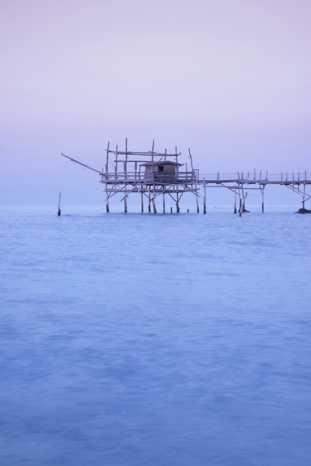 gray bridge on body of water