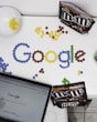 photo of M&M forming Google chocolate candies on table