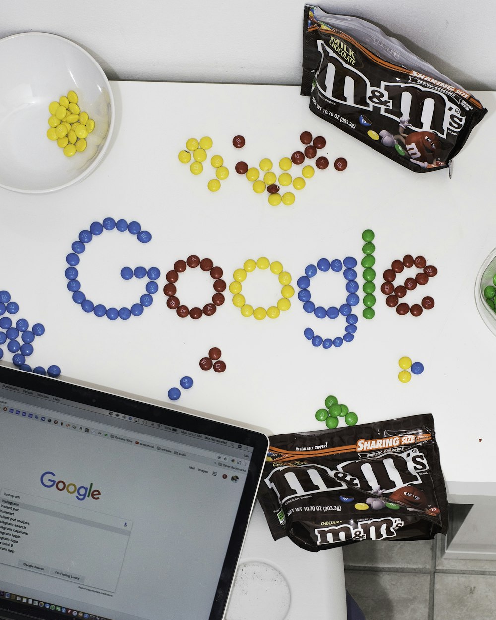 photo of M&M forming Google chocolate candies on table