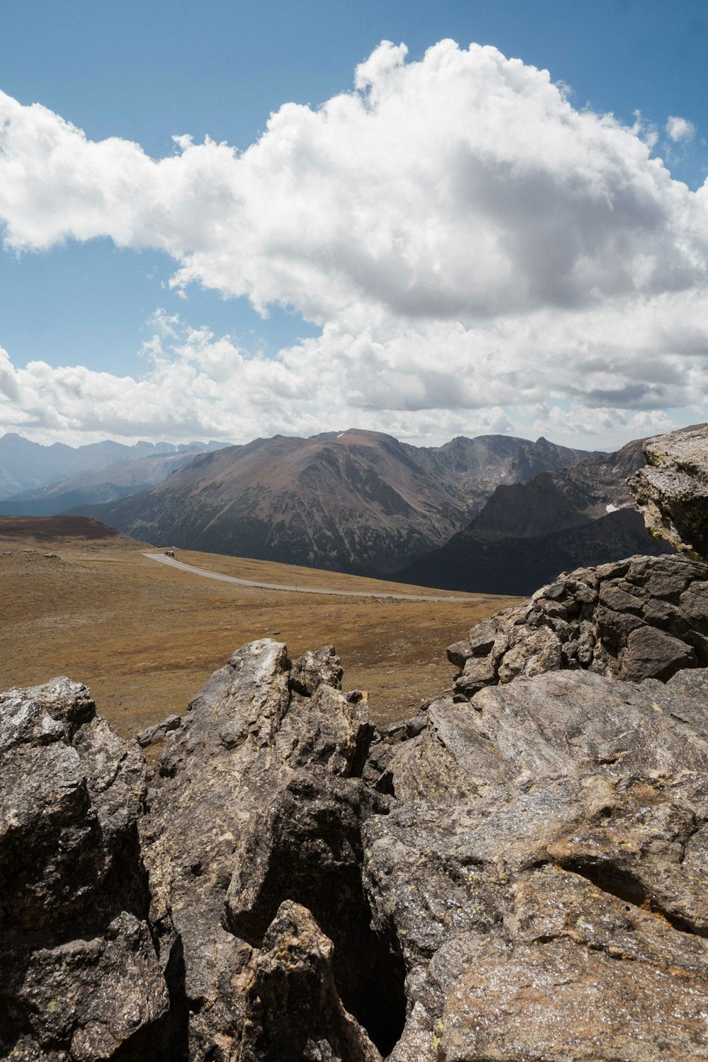 bird's-eye photography of mountain view under alto cumulus clouds