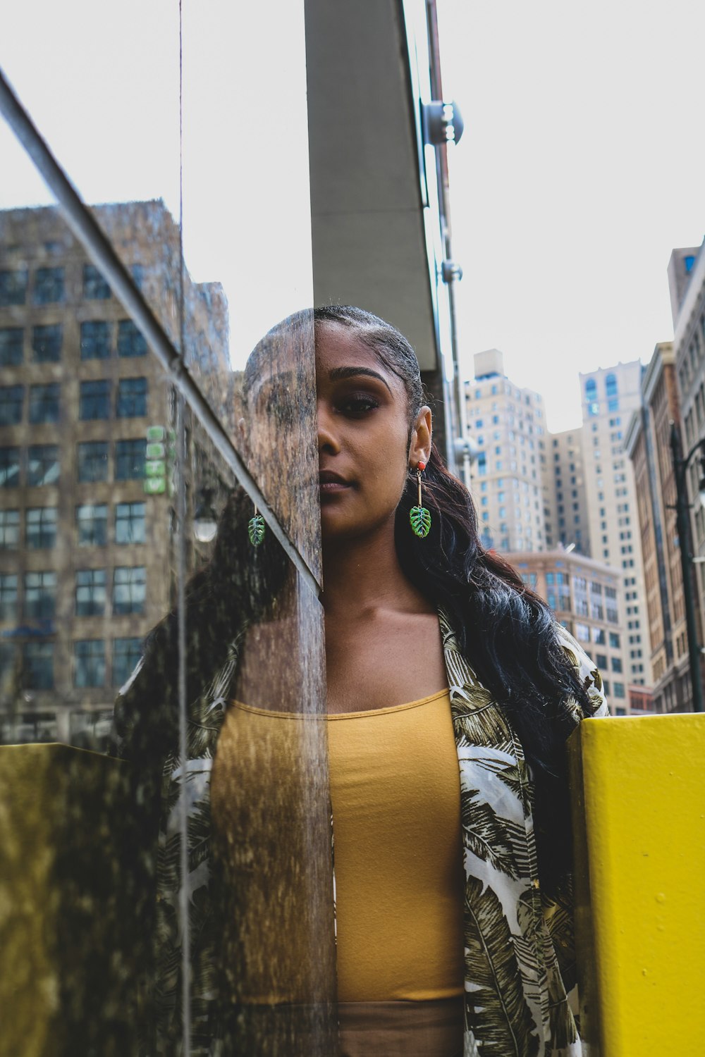 woman standing in front of tile wall