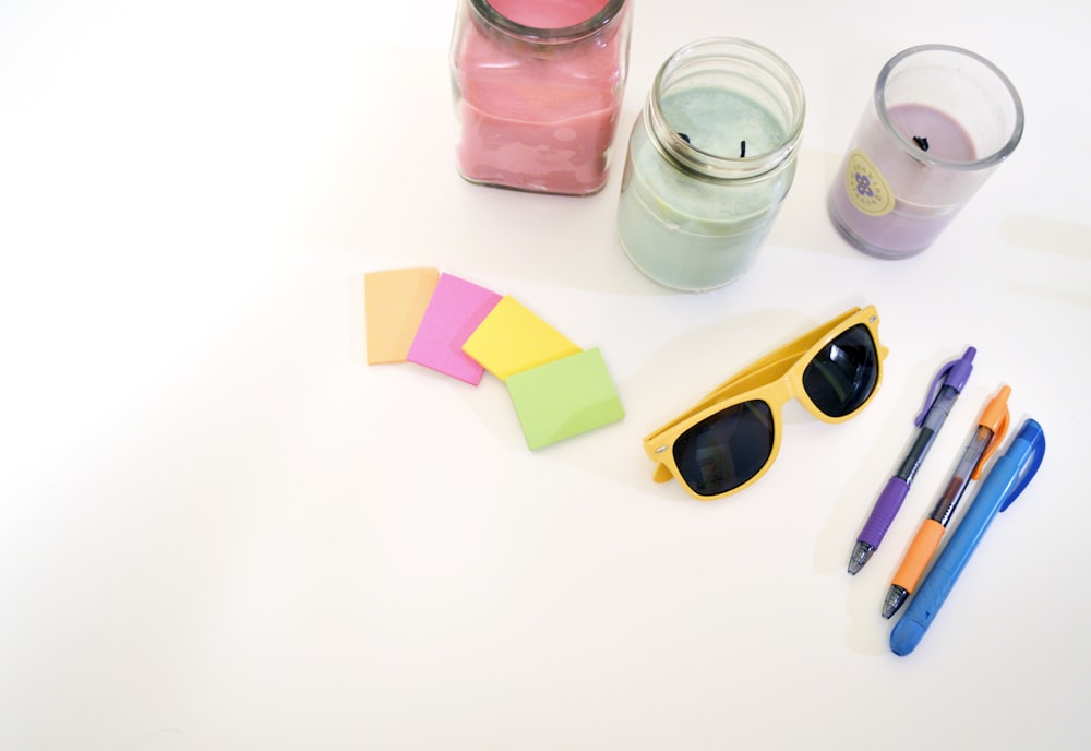 black wayfarer sunglasses with yellow plastic frames