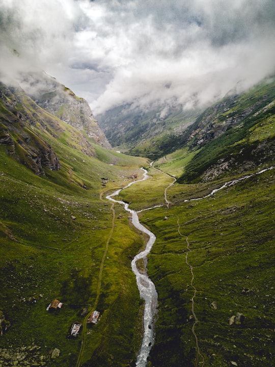 aerial photography of river between mountains in Aosta Italy