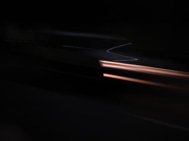 Abstract light streaks symbolizing speed and futuristic progress.