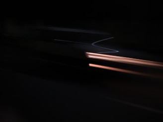 Abstract light streaks symbolizing speed and futuristic progress.