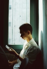 A serene setting with soft lighting, showing a person engaged in a thoughtful video conversation.