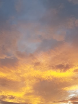 An artistic photo of a sunset blending warm colors.