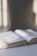 Open book resting on a wooden table with soft natural light.