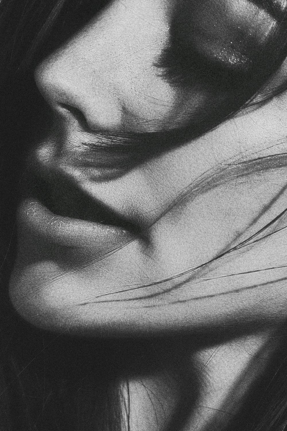 grayscale photo of woman's face