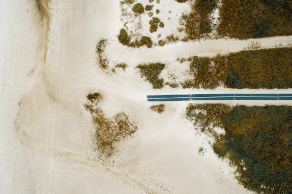 an aerial view of a snow covered road