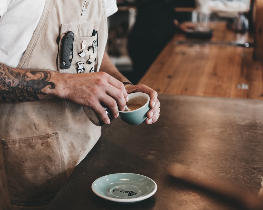 person holding cup