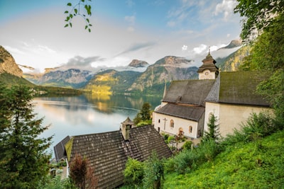 birds eye photography of concrete house near body of water town zoom background