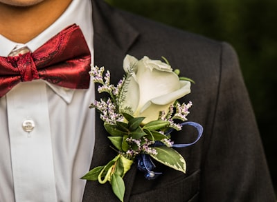 white rose on man's suit jacket prom google meet background