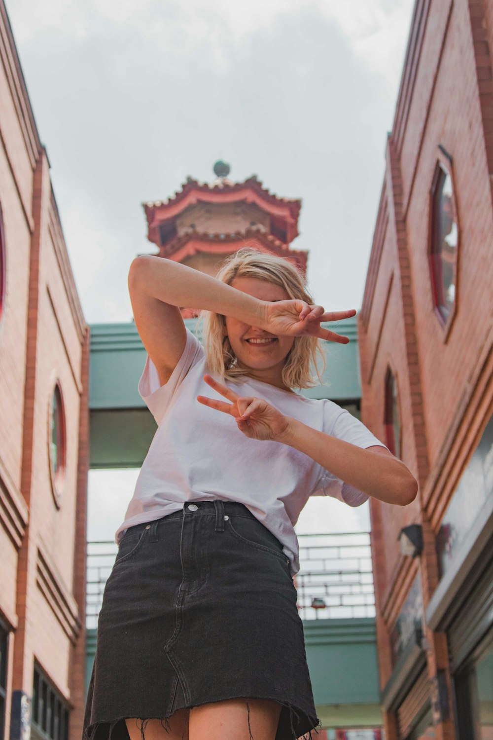 women's white crew-neck t-shirt and black skirt