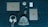 On a dark teal surface, a variety of items are neatly arranged. The items include a Dell laptop, a silver iPad, a white beanie hat, white headphones, a smartphone with a dark case, a black fitness tracker, a white cylindrical speaker, a white external hard drive, and a small USB drive.