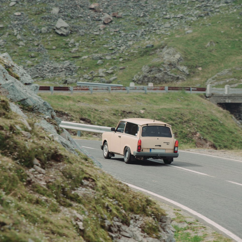 brown car near mountain