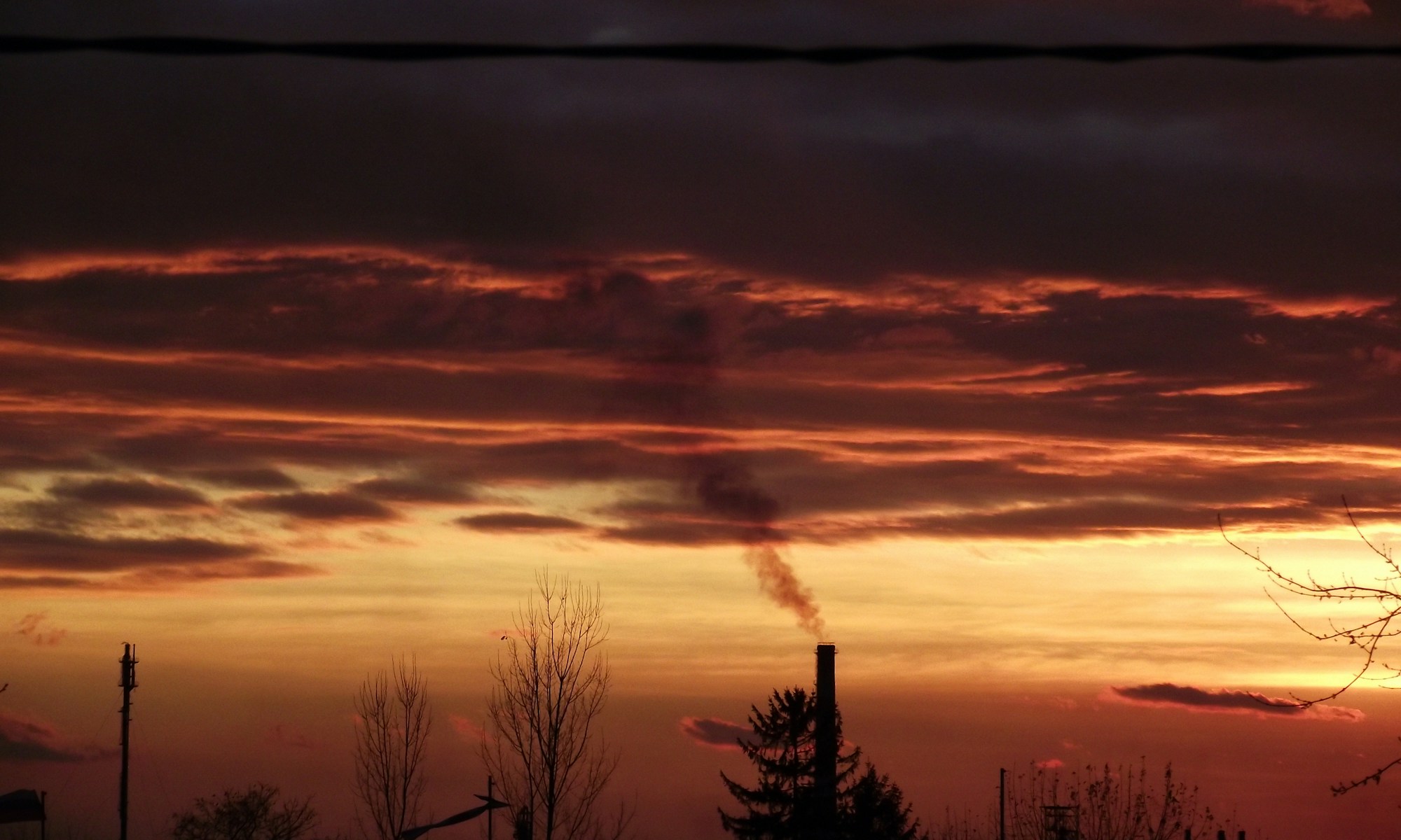 smoke going out on pipe during golden hour