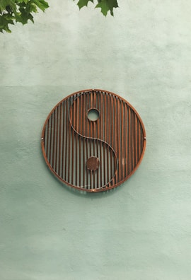 The yin-yang symbol artfully displayed on the studio wall, reflecting balance and harmony.