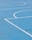 A basketball court showcasing bright, professionally applied stencils and logos.