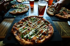 slice pizza on black tray