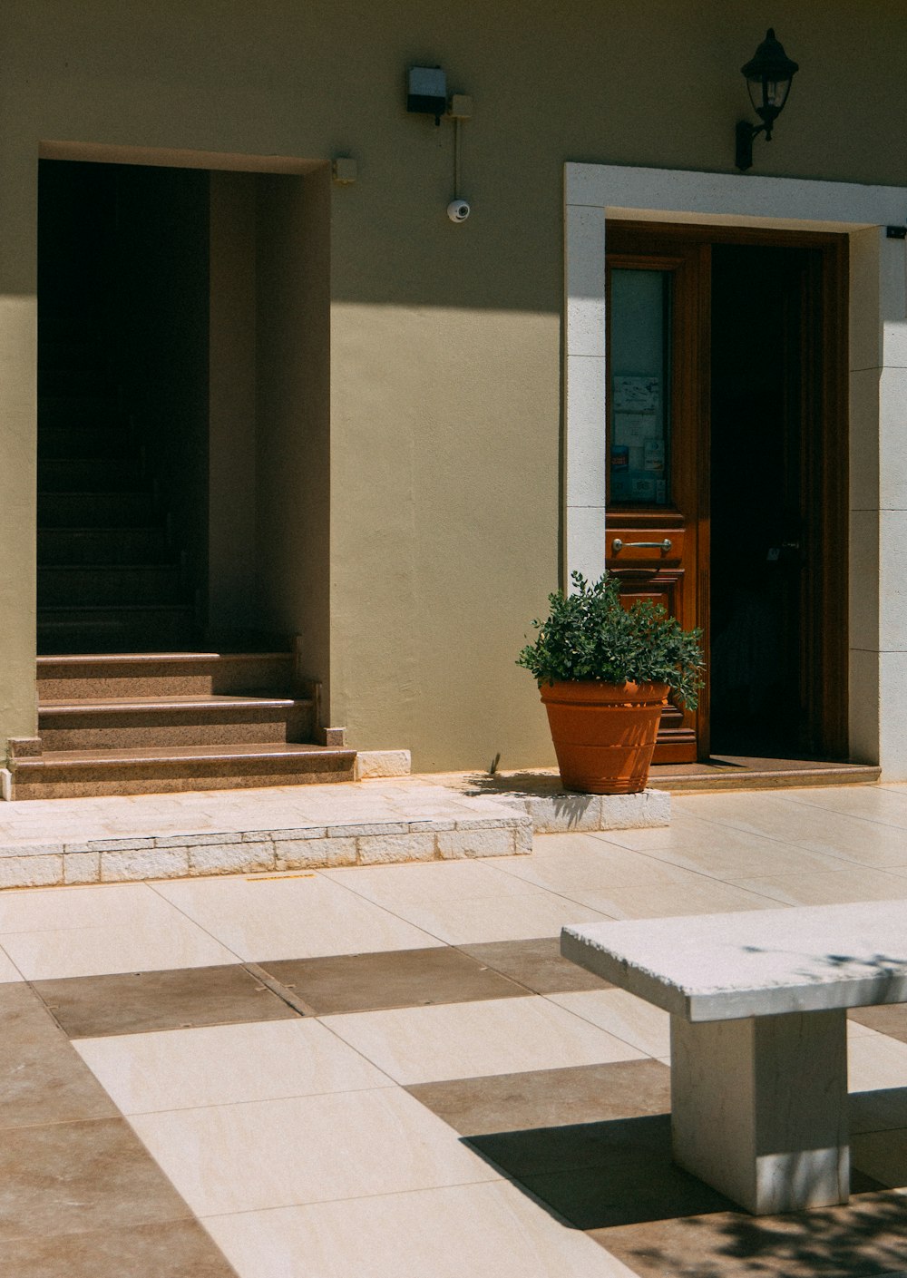 brown flower pot beside door on outdoors