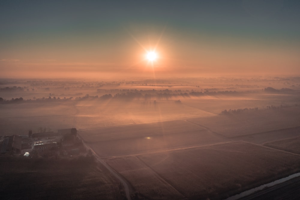 postal aerial photography of buildings and fog