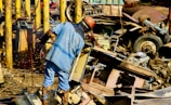 person standing near metal machien