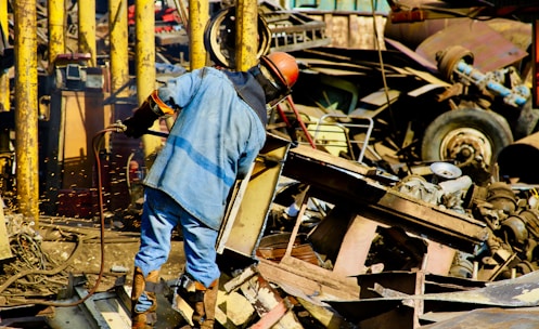 person standing near metal machien