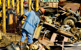 person standing near metal machien