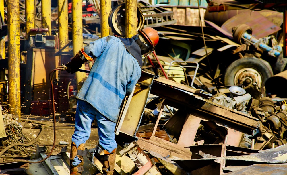 person standing near metal machien