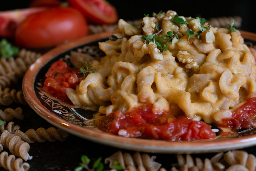 baked mac on round black ceramic plate