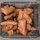 An array of silicone prosthetics in various shapes and sizes.