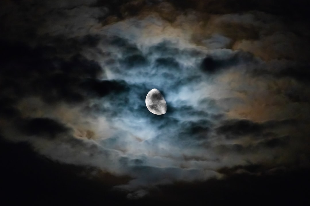 long exposure photography of moon and clouds