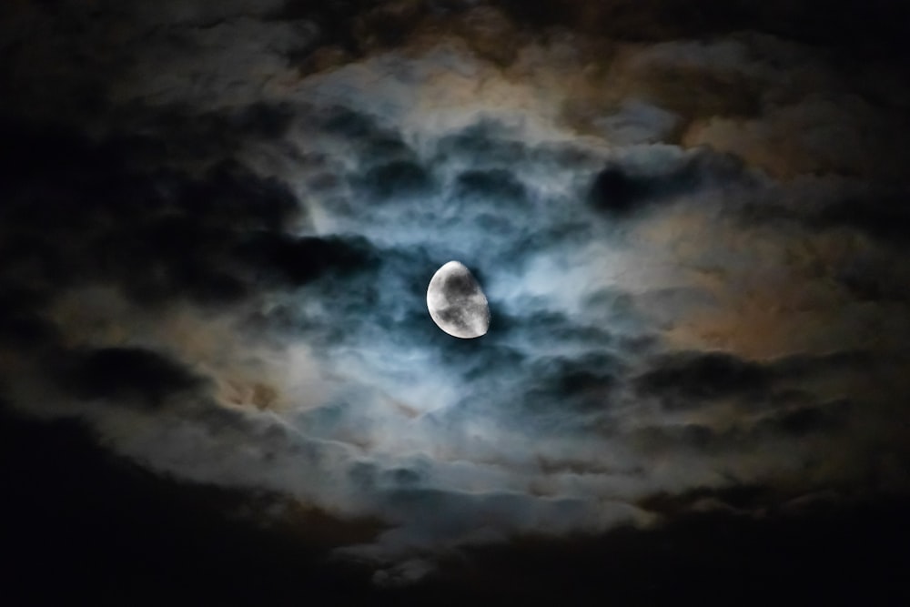 long exposure photography of moon and clouds