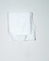 Close-up of a white EPS foam cornice with a smooth, durable red-coated surface.