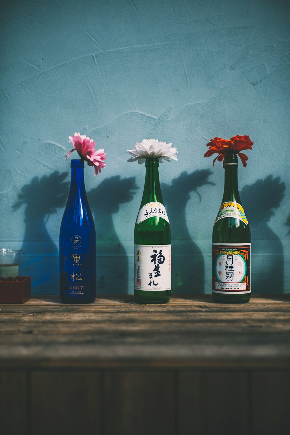 three green and blue bottle vases