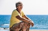 woman sitting on seashore