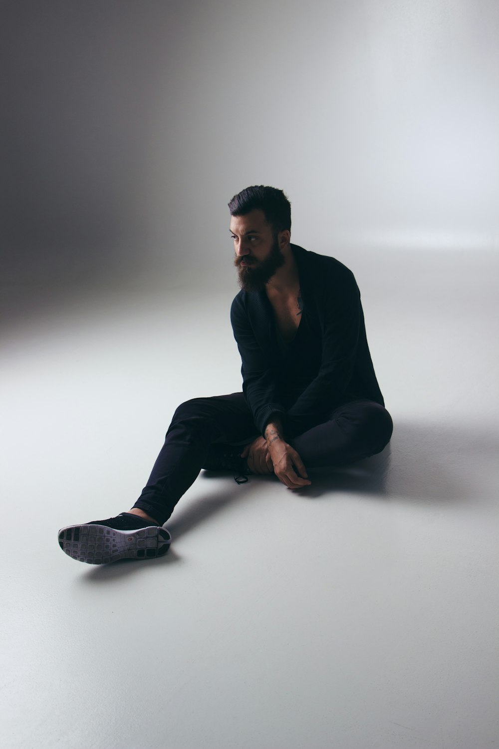 man sitting in white floor