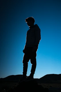 man stand on top of mountain