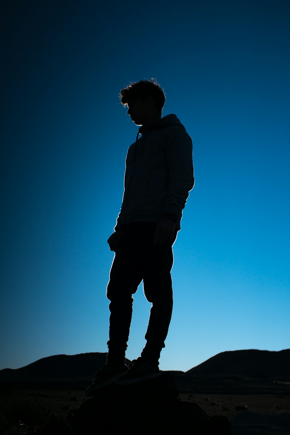 man stand on top of mountain