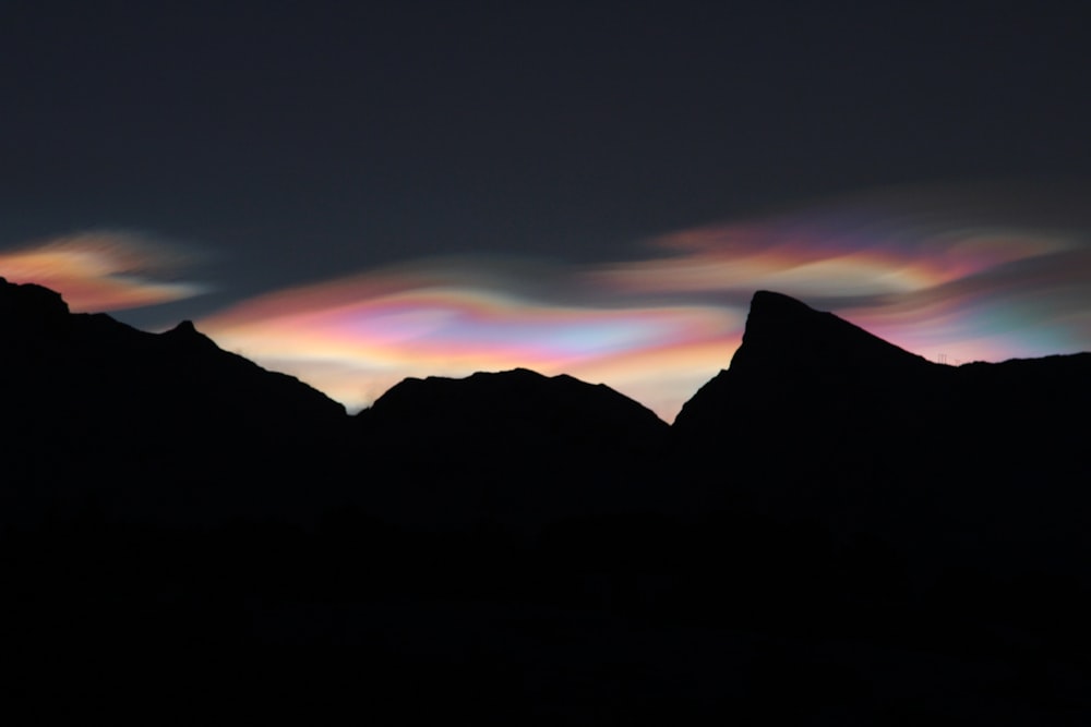 mountain silhouette during night time