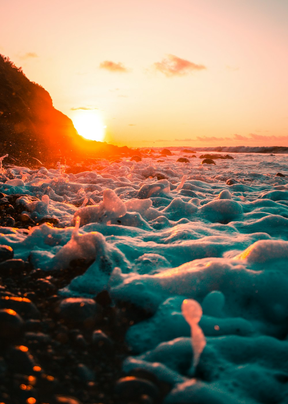 seashore bubbles against light at sunset